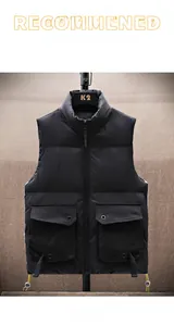 Detail view of black padded vest featuring utility flap pockets and adjustable drawstring hem