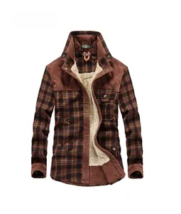 Detail of red plaid fleece shirt showing corduroy collar and warm sherpa lining inside