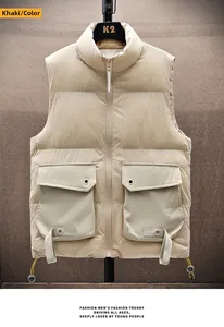 Detail of khaki puffer vest featuring functional utility pockets and warm stand collar