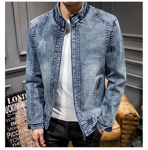 Detail of slim-fit men's vintage denim jacket with washed finish and stand collar zipper