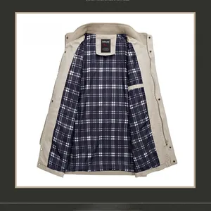Detail view of khaki jacket interior featuring classic blue and white plaid lining fabric