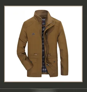 Detail of dark khaki men jacket featuring a stand collar and black white checkered lining