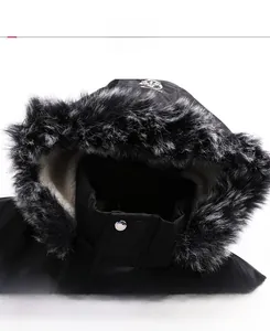 Detail of hooded winter jacket showing faux fur trim and soft fleece lining with button