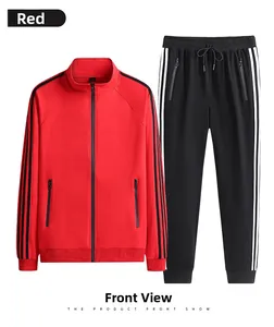 Flat lay of a red zip-up jacket and black track pants with iconic triple stripes