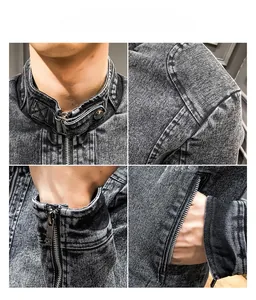 Close-up of vintage grey washed denim jacket details with zippers and metal buttons