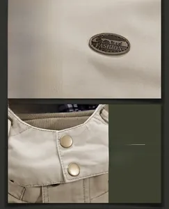 Detailed macro view of the khaki cotton jacket featuring leather fashion label and metal button