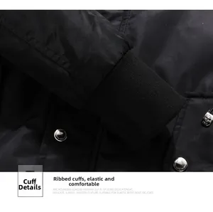 Close-up of black jacket ribbed cuffs with silver metal snap button and logo zipper detail