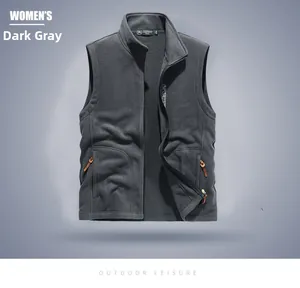 Detail of dark gray fleece vest featuring standing collar and leather zipper puller