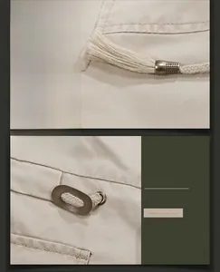 Detail of waist drawstring and vintage leather eyelet on khaki twill cotton jacket