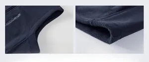 Detailed view of sleeve cuffs and hem stitching on blue fleece vest with Sport Outdoor logo