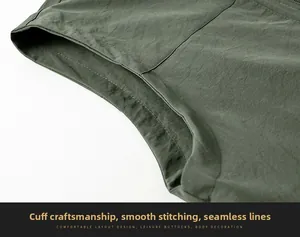 Détail de la veste verte à séchage rapide montrant des coutures plates et précises