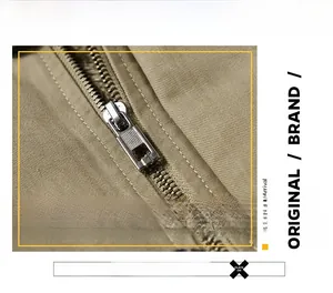 Detailed close-up of premium metal zipper and khaki twill fabric on winter jacket