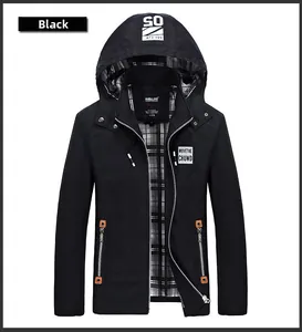 Detail of black hooded jacket featuring contrast orange zipper trim and plaid lining