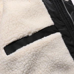 Men's winter jacket with white faux shearling lining and black matte exterior details