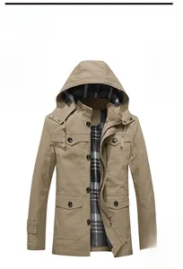 Detail of khaki hooded jacket with front flap pockets and classic plaid fabric lining