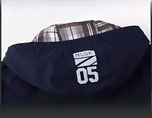 Detail of navy blue hoodie with checkered lining and detachable collar feature