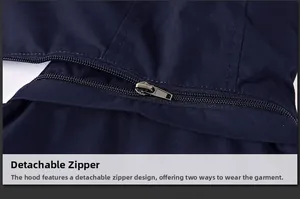 Detail view of the durable metal zipper on a dark blue men's hooded windbreaker jacket
