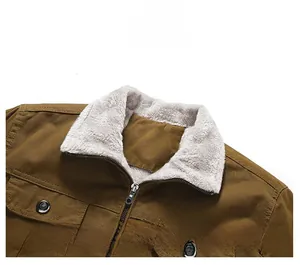 Detail of classic collar with white faux shearling lining on brown cotton work jacket