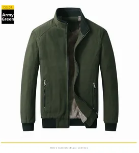 Detail of green men's military jacket showing warm thick fleece lining and durable fabric