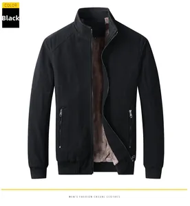 Detail view of winter men's black jacket with thick brown fleece lining and metal zipper