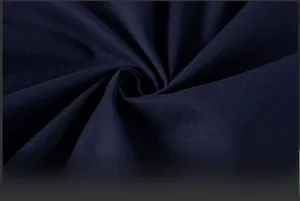 Detailed texture of navy blue breathable fabric showing fine weave and soft drape