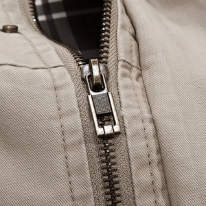 Men's khaki cotton jacket with bronze metal zipper and classic plaid lining detail