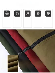 Detailed fabric texture of cotton jackets showing khaki, olive, and red durable canvas