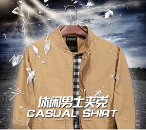 Detail view of brown cotton jacket collar with stand-up design and checkered lining