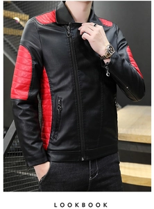 Close-up of black PU leather jacket with red patchwork and diagonal zip details