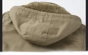 Detailed view of the jacket's hood featuring thick brown faux fur lining for extra warmth