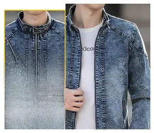 Detail of dark blue snowflake wash denim jacket featuring a zipper chest pocket and collar