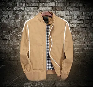 Detail of khaki cotton jacket showing 3D ergonomic tailoring and plaid inner lining