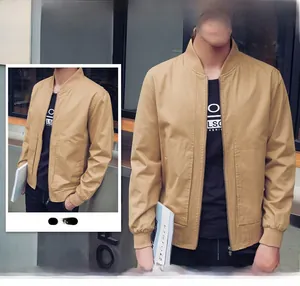 Detail view of khaki cotton bomber jacket with ribbed collar and zipper closure for men