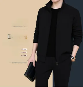 Detail of men's black knit sports set featuring a stand collar zip jacket and casual pants