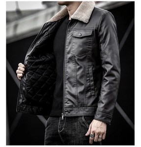Detail of black faux leather jacket featuring off-white shearling collar and quilted lining
