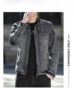 Detail of a men's washed grey denim jacket with stand-up collar and shoulder stitching