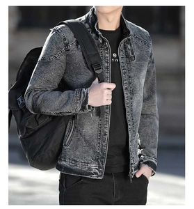 Detail of grey washed denim jacket for men featuring a zipper and stand-up collar