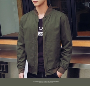 Detail view of army green bomber jacket with ribbed collar and metal zipper pockets