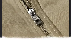 Detail of durable metal zipper and high-density twill cotton fabric on men's winter jacket