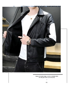 Detail of black motorcycle faux leather jacket with white patchwork and chest zippers