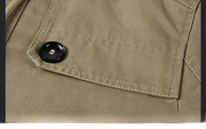 Detail of chest pocket stitching and black button on khaki fleece windbreaker jacket
