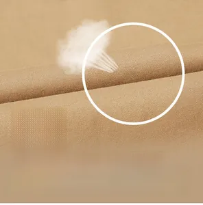 Detailed close-up of breathable khaki cotton twill fabric with soft textile texture