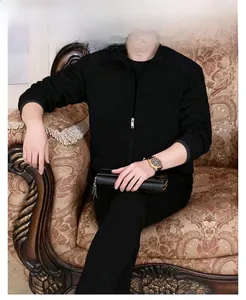 Detail of men's black slim-fit zip-up jacket with stand collar and smooth texture
