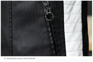 Close-up of black leather jacket featuring white quilted panels and silver ring zipper pull