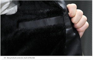 Detail of the warm black plush fleece lining and stitching on the faux leather jacket
