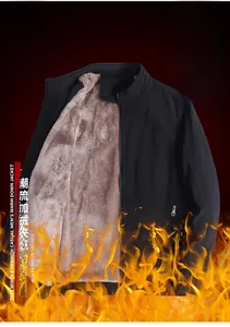 Detail of warm black men's jacket with thick brown fleece lining and metal zipper closure