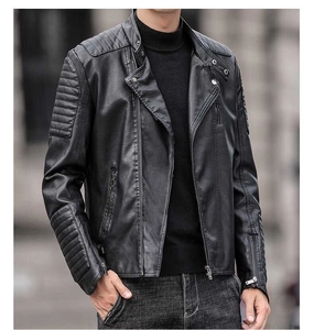 Close-up of black biker leather jacket with quilted sleeve details and metallic zippers