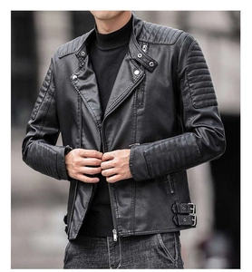 Detail of black faux leather biker jacket featuring quilted sleeves and metal hardware