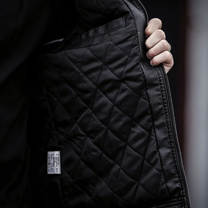 Men's black faux leather biker jacket with diamond quilted lining and lychee texture