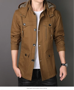 Detail of brown fleece-lined winter parka featuring four flap pockets and hood with grey lining